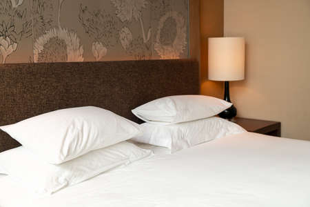 white pillow decoration on bedの写真素材