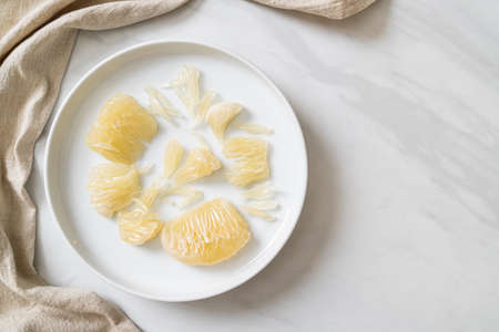 Fresh peeled pomelo, grapefruit or shaddockの写真素材