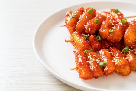 deep fried Korean rice cake (Tteokbokki) skewered with spicy sauce
