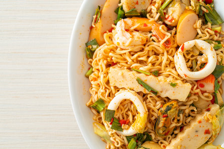Instant noodle spicy salad with mixed meatsの写真素材