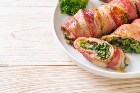 baked bacon stuffed spinach and cheeseの写真素材