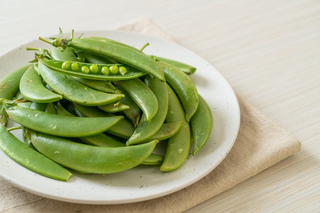 fresh sweet green peas on plate