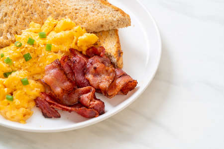 scrambled egg with bread toasted and baconの写真素材