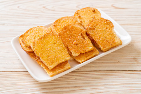 baked crispy bread with butter and sugar