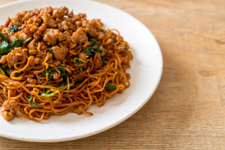 stir-fried instant noodles with Thai basil and minced porkの写真素材