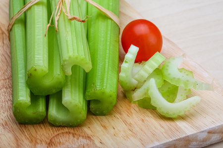 Fresh Green Celery sticks on the wood backgroundの素材