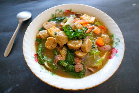 sapo tofu or sapo tahu food from china (Chinese food) made from tofu, vegetables, shrimp, mushrooms, and meatball. sapo tofu served on bowの素材