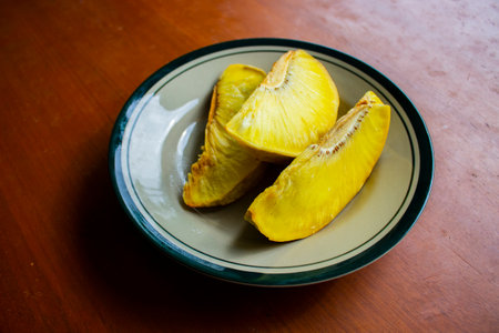 sukun goreng or fried breadfruit served at plate on black backgroundの素材