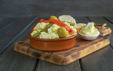 Russian salad typical fresh summer food with hard-boiled egg, pepper and tunaの素材