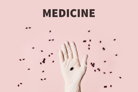 Hand in medical glove with tablet on pink background. Photo on the theme of coronavirus 2019-ncov in China. Flat lay, top view.の素材