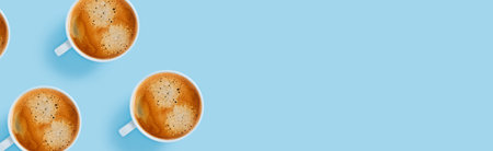 Morning cup of strong coffee with five pieces of sugar in the shape of hearts on blue background.の素材