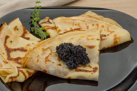 Pancakes with black caviar - russian style breakfastの素材