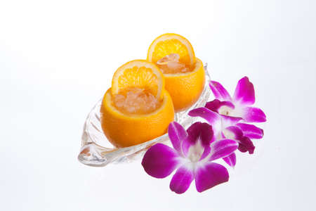 orange juice in orange peel  in isolate white backgroundの写真素材