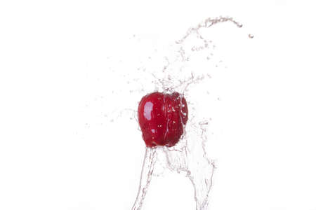 Red Apple With water splash in isolate white backgroundの写真素材