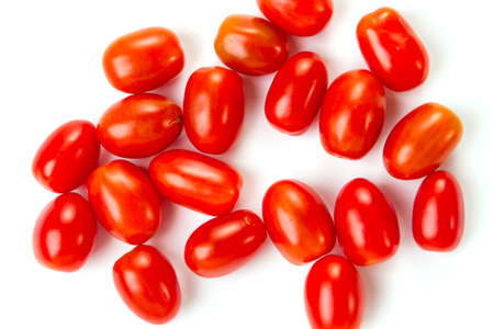 delicious little cherry tomatoes on a white backgroundの写真素材