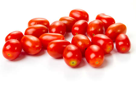 delicious little cherry tomatoes on a white backgroundの写真素材