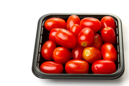 delicious little cherry tomatoes on a white backgroundの写真素材