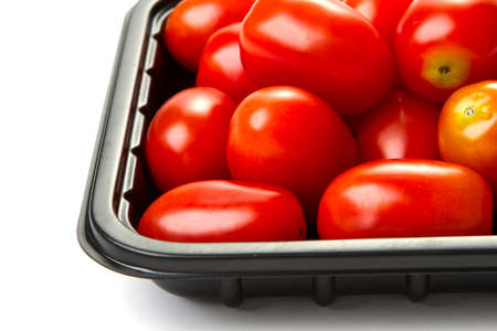 delicious little cherry tomatoes on a white backgroundの写真素材