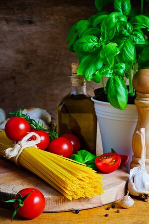 Still life with italian cooking ingredients for spaghettiの写真素材
