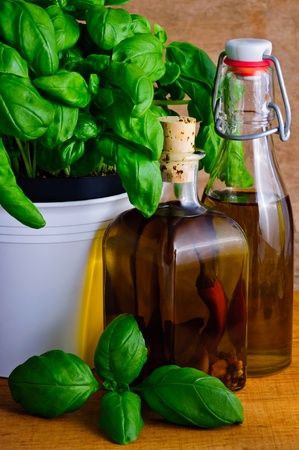 Still life with infused herbal oil and basilの写真素材