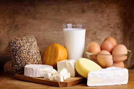 still life with dairy products, milk, eggs, bread and cheeseの写真素材