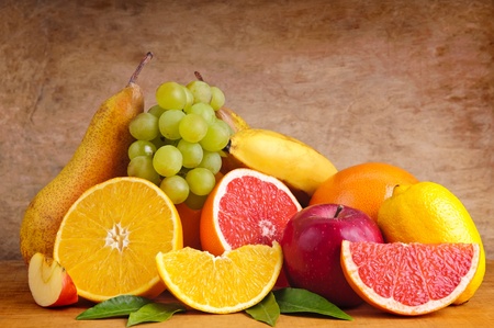 still life with colorful group of fruits on a wooden backgroundの写真素材