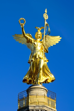 golden angel statue on victory column berlin, germanyの写真素材