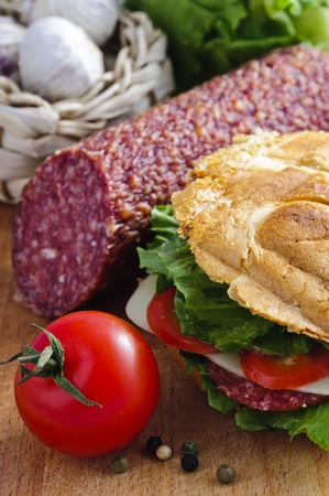 healthy sandwich with salami, tomato, cheese and lettuceの写真素材