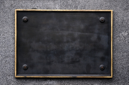blank street sign hanging on wallの写真素材