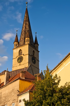 church from historic center in sibiu (Hermannstadt) at sunsetの写真素材