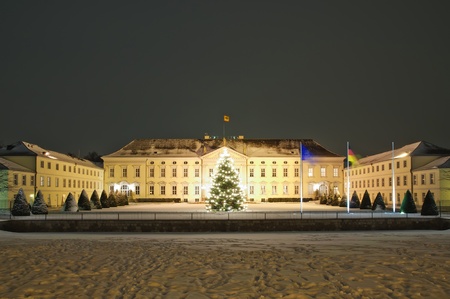 schloss bellevue in berlin in winter at night with beautiful christmas treeの写真素材