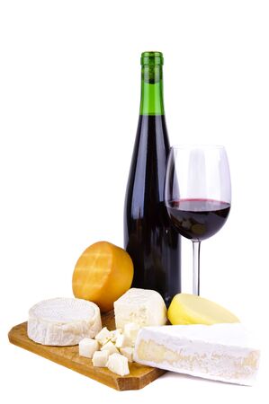 glass and bottle of red wine with differnt cheese isolated on a white backgroundの写真素材