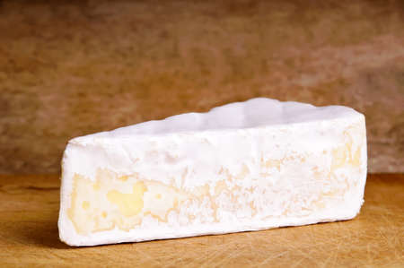 brie cheese against a wooden backgroundの写真素材