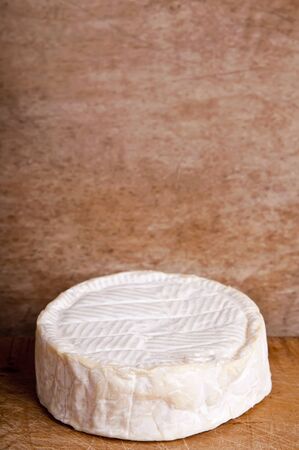 camembert chesse on a wooden backgroundの写真素材