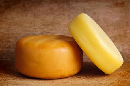 traditional cheese on a vintage wooden backgroundの写真素材