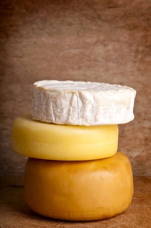 group of different cheese on a wooden backgroundの写真素材