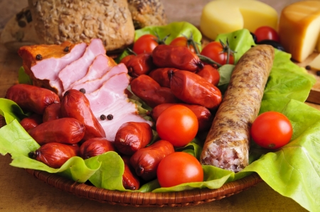 still life with traditional sausages and vegetablesの写真素材