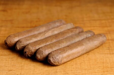 close up of cuban cigars on a wooden backgroundの写真素材
