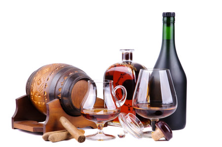 french cognac and cuban cigars isolated on a white background