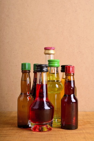 bottles of alcohol drinks on a wooden backgroundの写真素材