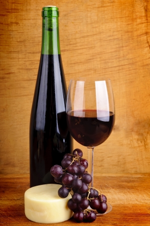 still life with red wine, cheese and grapesの写真素材