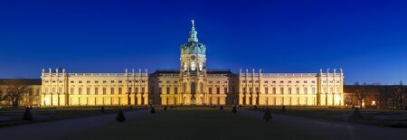 panorama with schloss charlottenburg and park in berlin, germany, at nightのeditorial素材