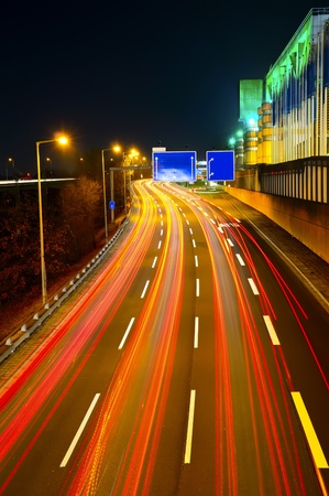 highway city traffic at night in berlinの写真素材