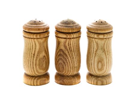 salt, pepper and paprika in wooden condiement container isolated on a white backgroundの写真素材