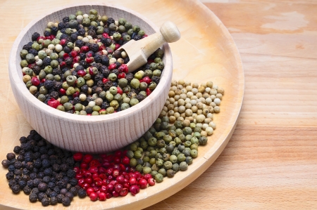 still life with black, red, green and white pepper and copy spaceの写真素材