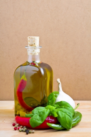 still life with infused olive oil with herbs and spicesの写真素材
