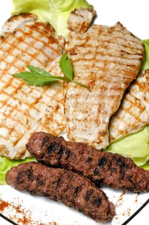 plate with traditional romanian grilled meat (mici)の写真素材
