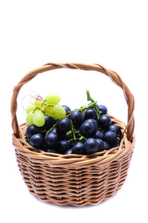 basket with grapes isolated on a white backgroundの写真素材