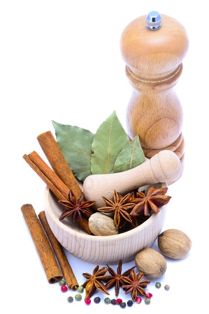 different spice with pepper mill, mortar and pestle isolated on a white backgroundの写真素材