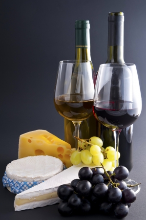still life with cheese, wine and grapesの写真素材